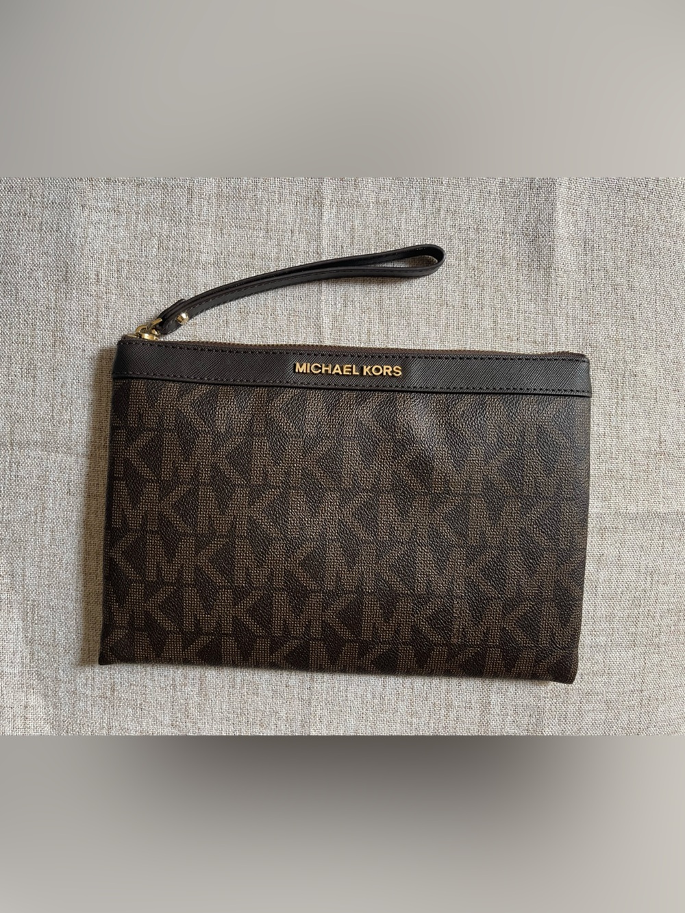 Michael Kors Dark Brown Signature MK Wristlet with Gold tone Hardware